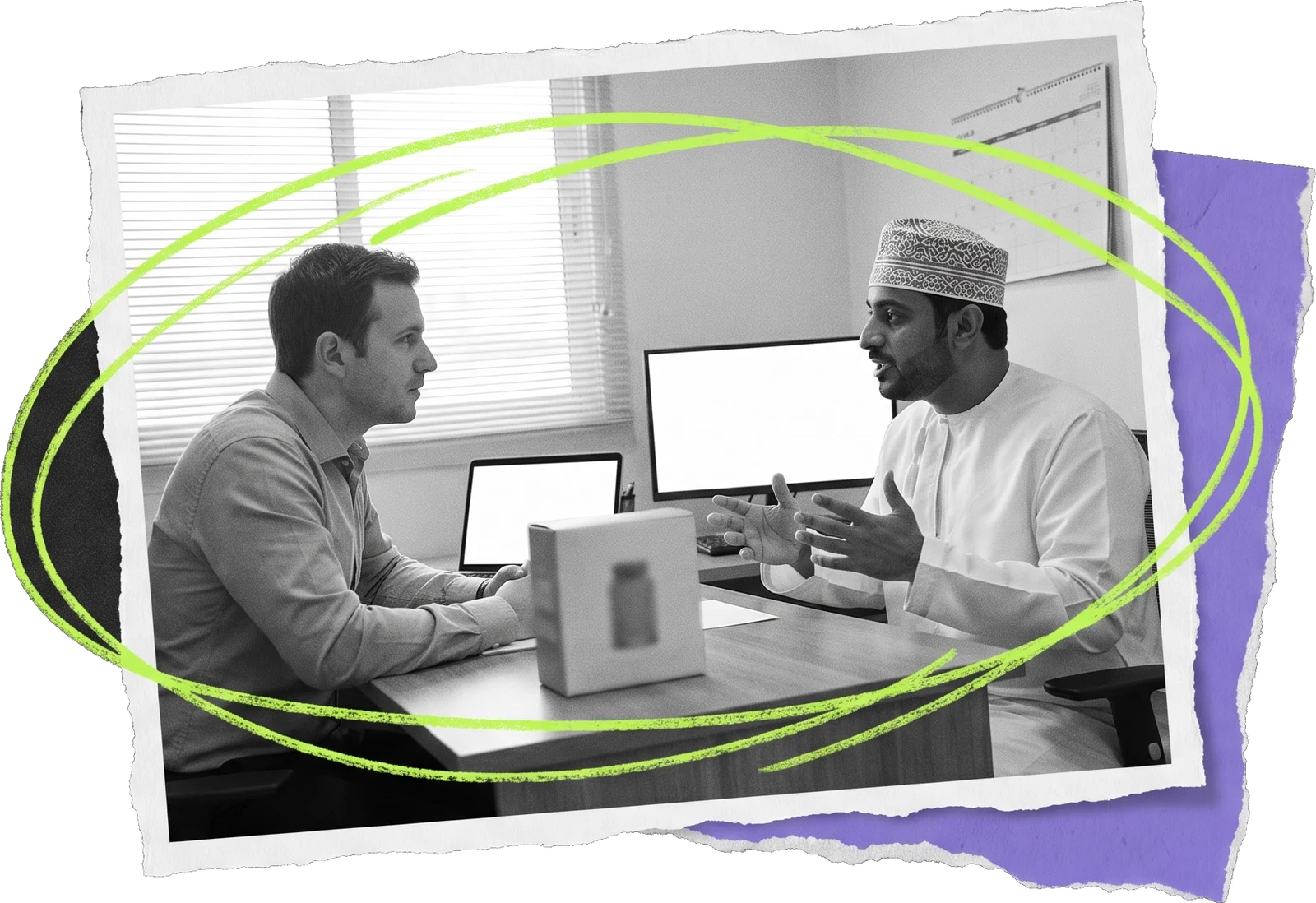 Black-and-white photo of two men at an office table with a product box between them, in conversation, circled in green.