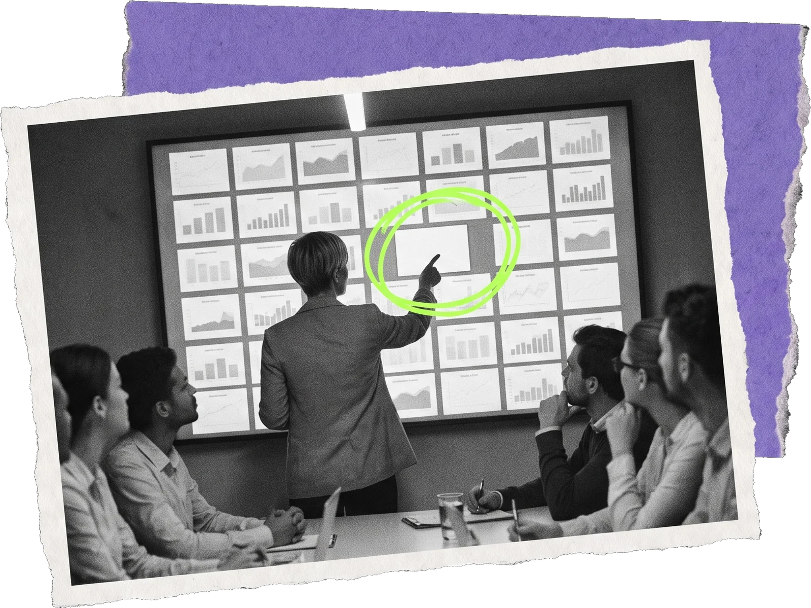 Black-and-white photo of a presenter pointing at a wall of dozens of small chart tiles; one tile is circled in green.