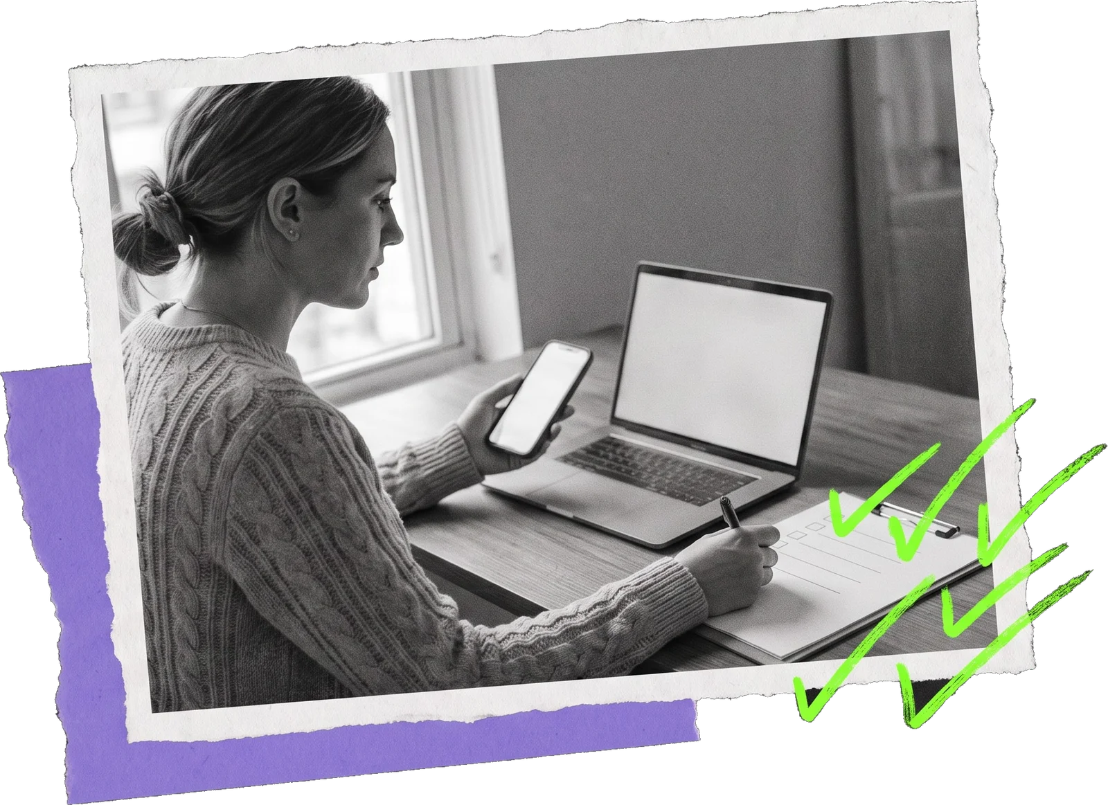 Black-and-white photo of a woman at a table with a laptop, a phone and a notebook, with green ticks drawn beside her notes.