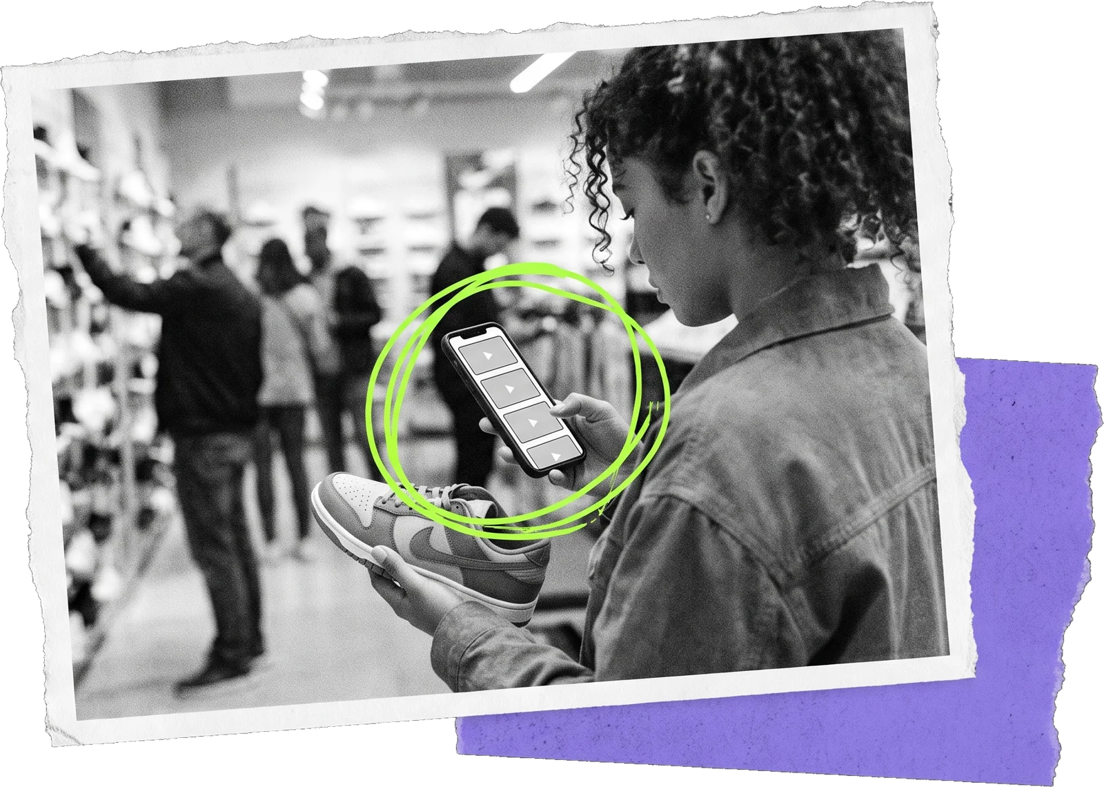 Black-and-white photo of a woman in a shoe shop holding a sneaker in one hand and her phone in the other; the phone is circled in green.