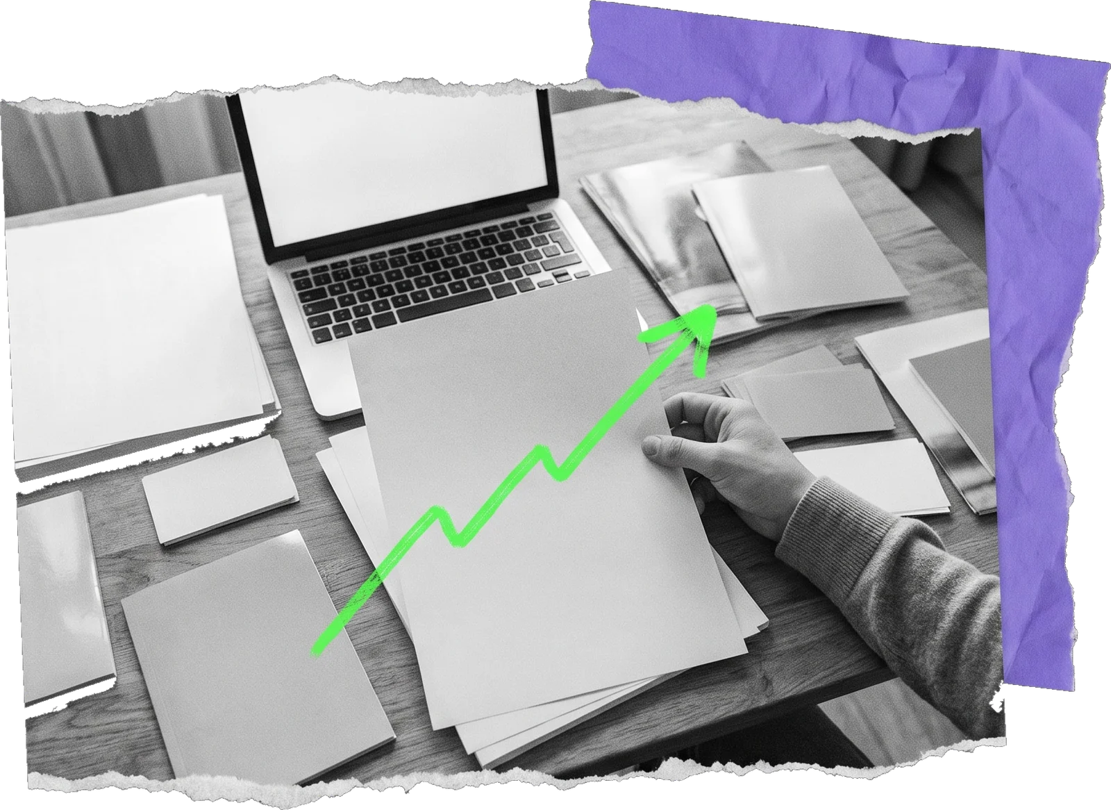 Black-and-white photo of a hand resting on printed pages beside an open laptop, with a green rising arrow drawn over the papers.