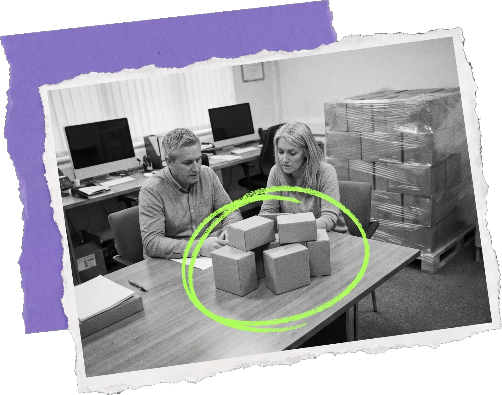 Black-and-white photo of two colleagues at an office table with a small group of boxes between them, circled in green, while a full pallet of boxes stands wrapped behind them.