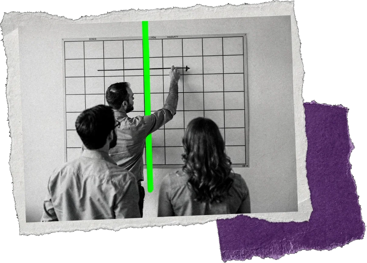 Black-and-white photo of three colleagues at a grid on a wall, one drawing a line across it, with a green vertical line marking the gate.