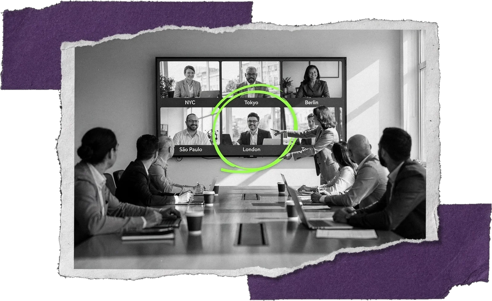 Black-and-white photo of a meeting room where colleagues face a wall screen with six video-call tiles labelled with city names; one tile is circled in green.